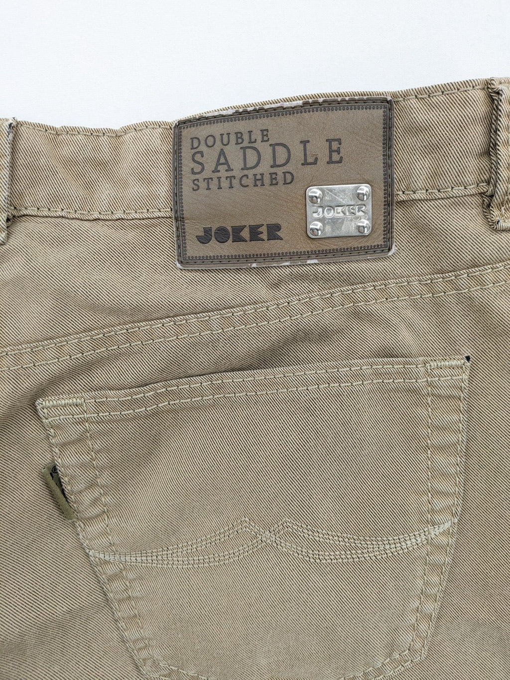 Joker beige straight jeans with double saddle stitching and classic 5-pocket design.