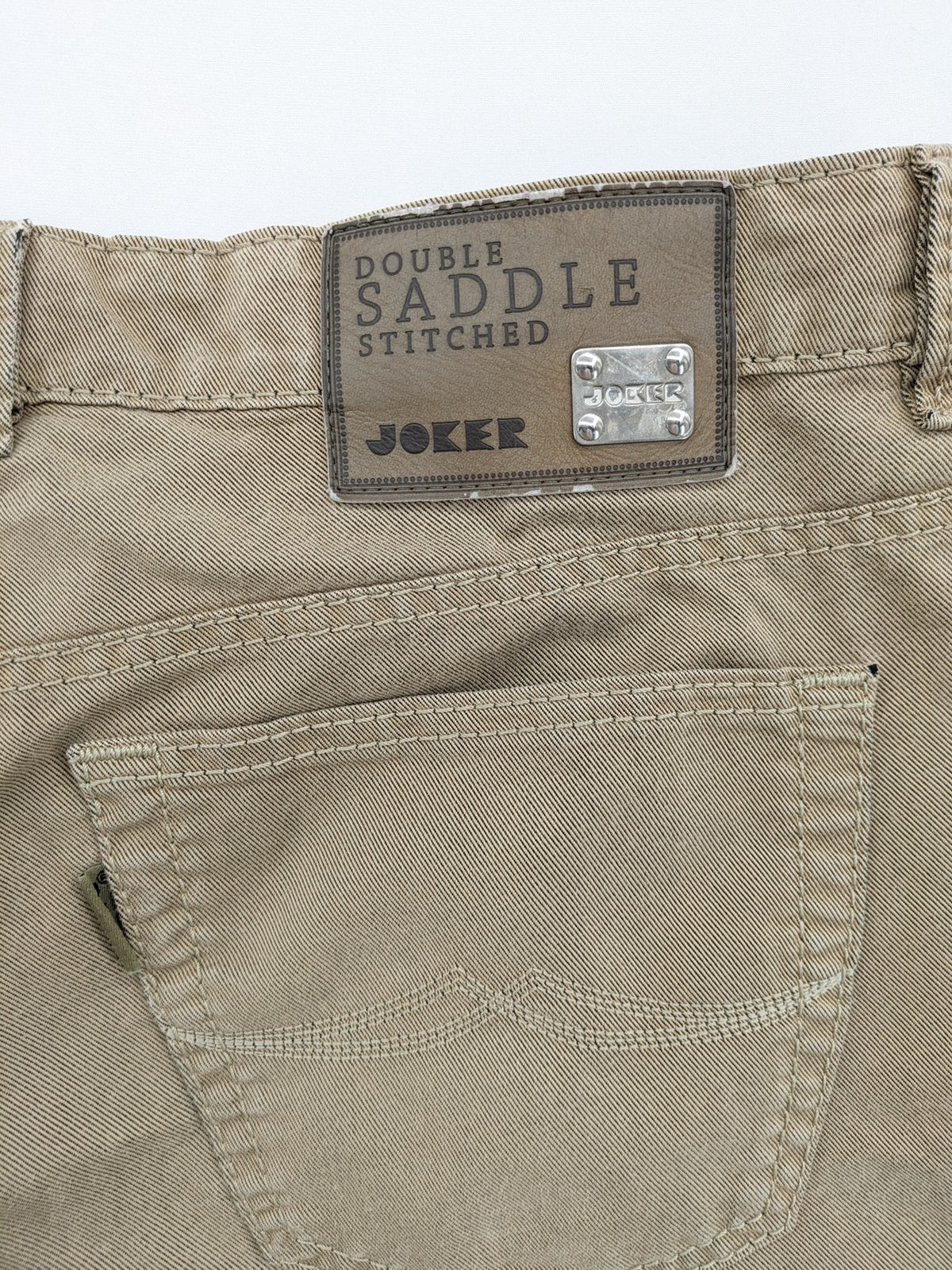 Joker beige straight jeans with double saddle stitching and classic 5-pocket design.
