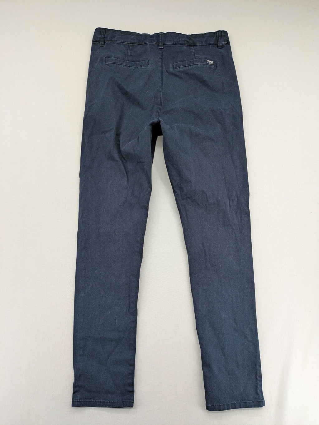 H&M navy chino pants with stretch, classic design, soft cotton blend material.