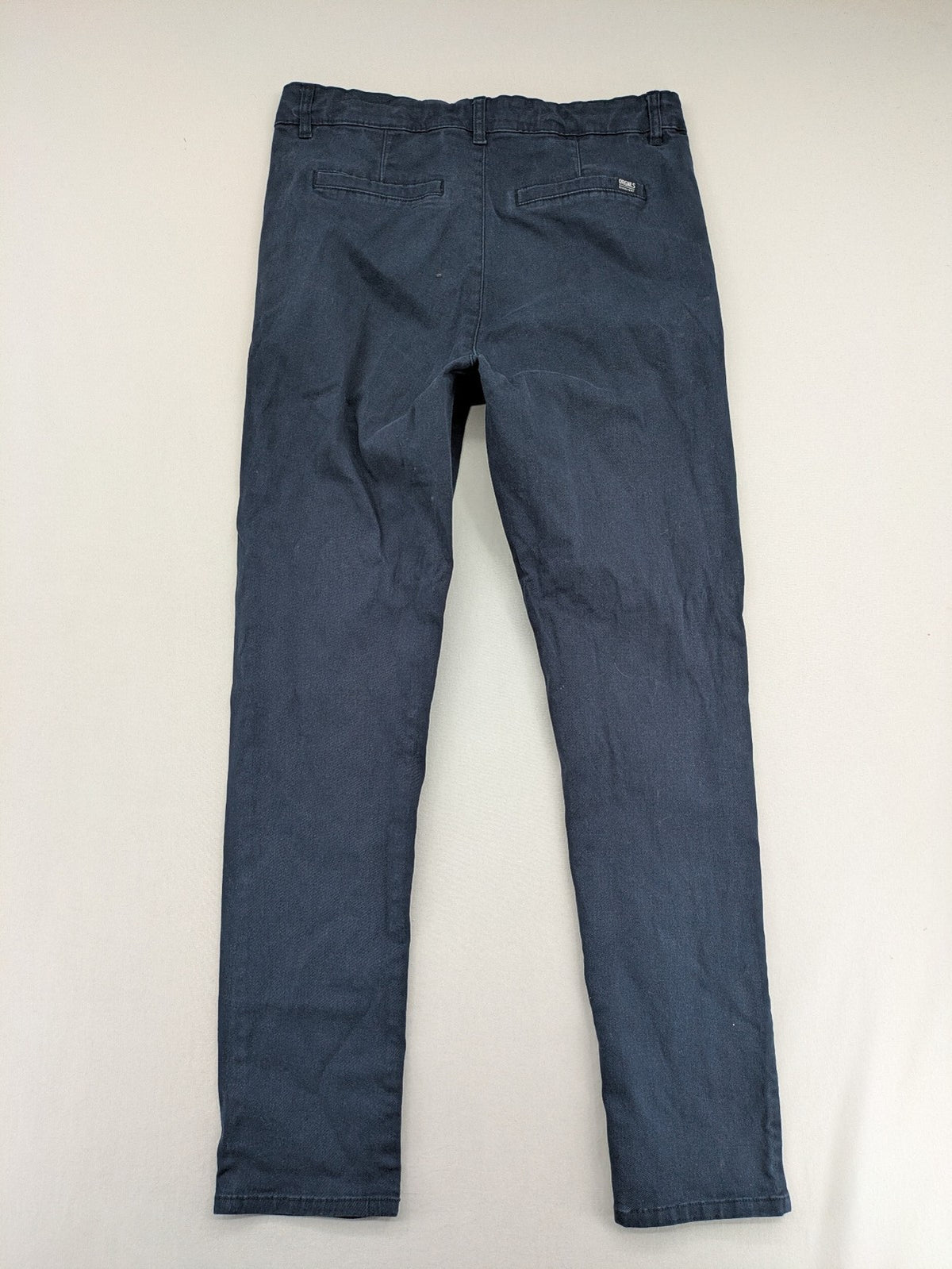 H&M navy chino pants with stretch, classic design, soft cotton blend material.