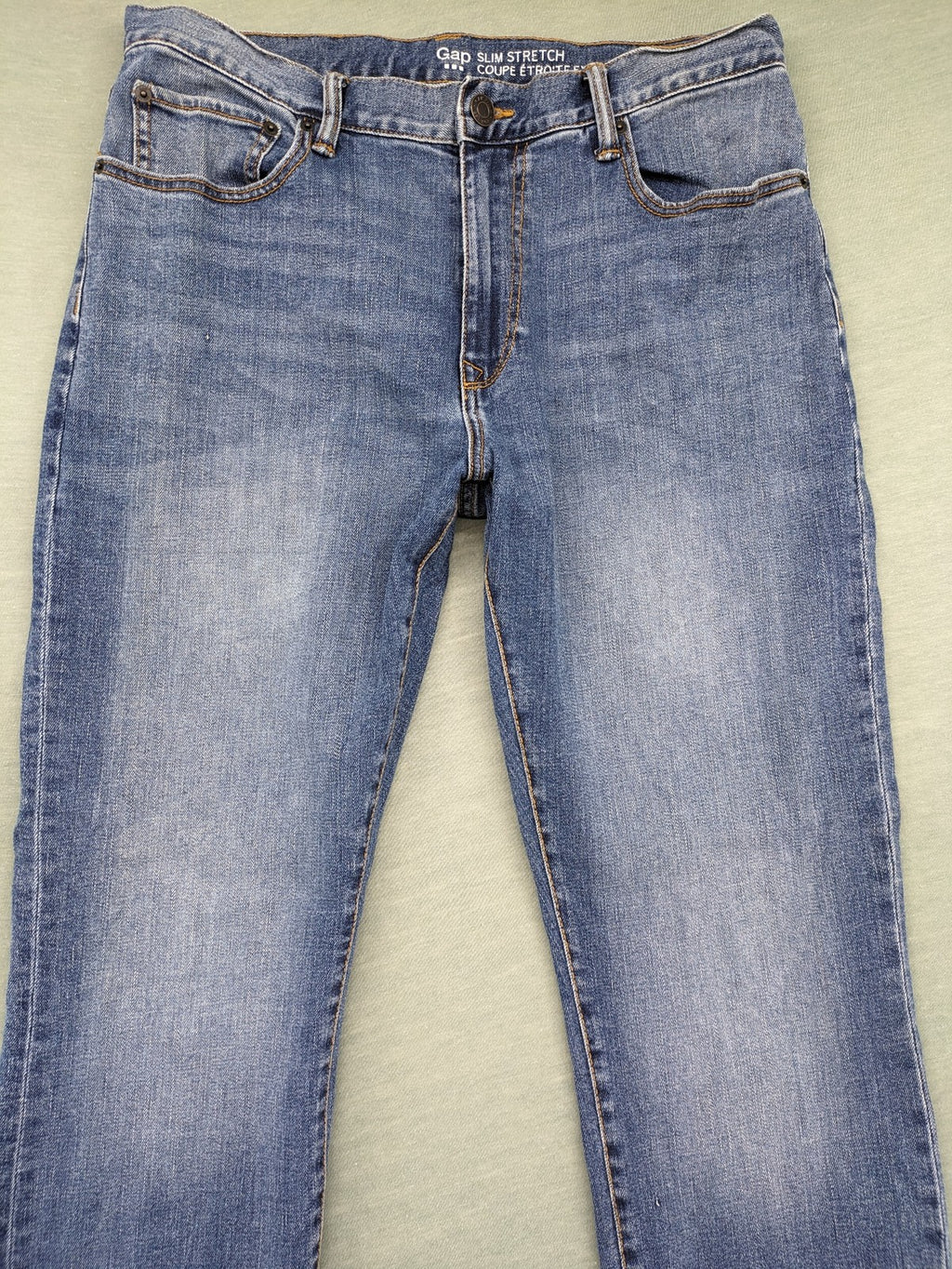 Gap blue straight jeans slim stretch fit with classic denim wash and logo tag.
