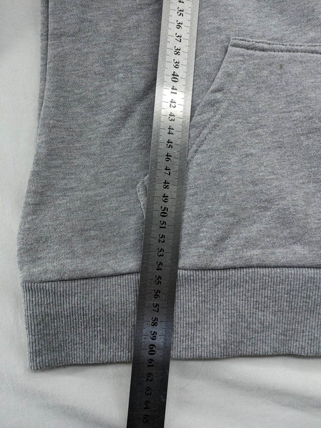 Superdry grey hoodie with Sonics logo, number 7 detail, kangaroo pocket, and drawstring hood.