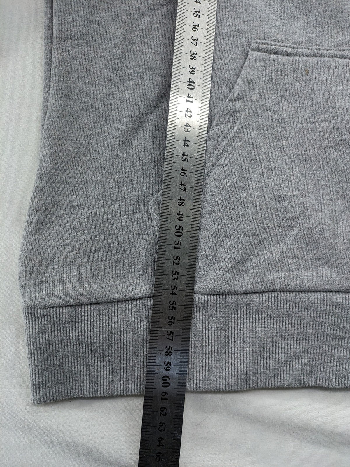 Superdry grey hoodie with Sonics logo, number 7 detail, kangaroo pocket, and drawstring hood.