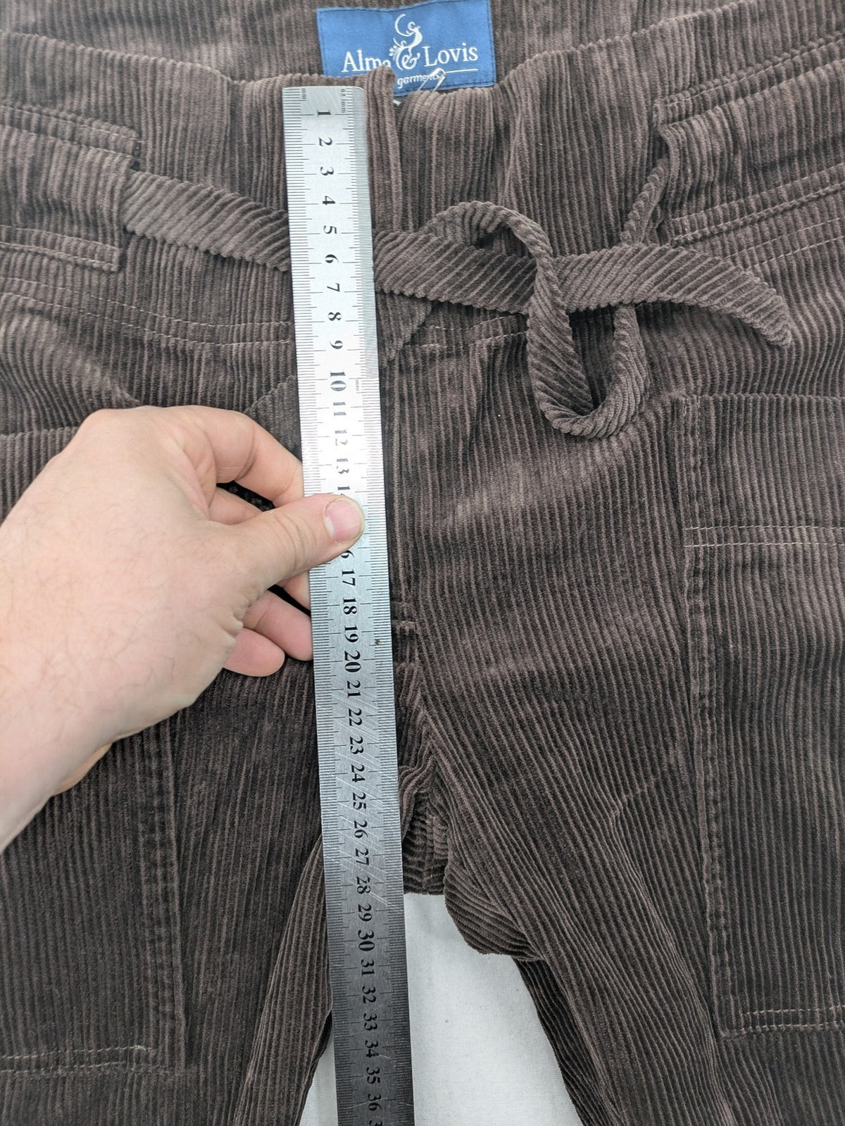 Alma & Lovis brown cord pants paperbag style with belt, made from organic cotton.