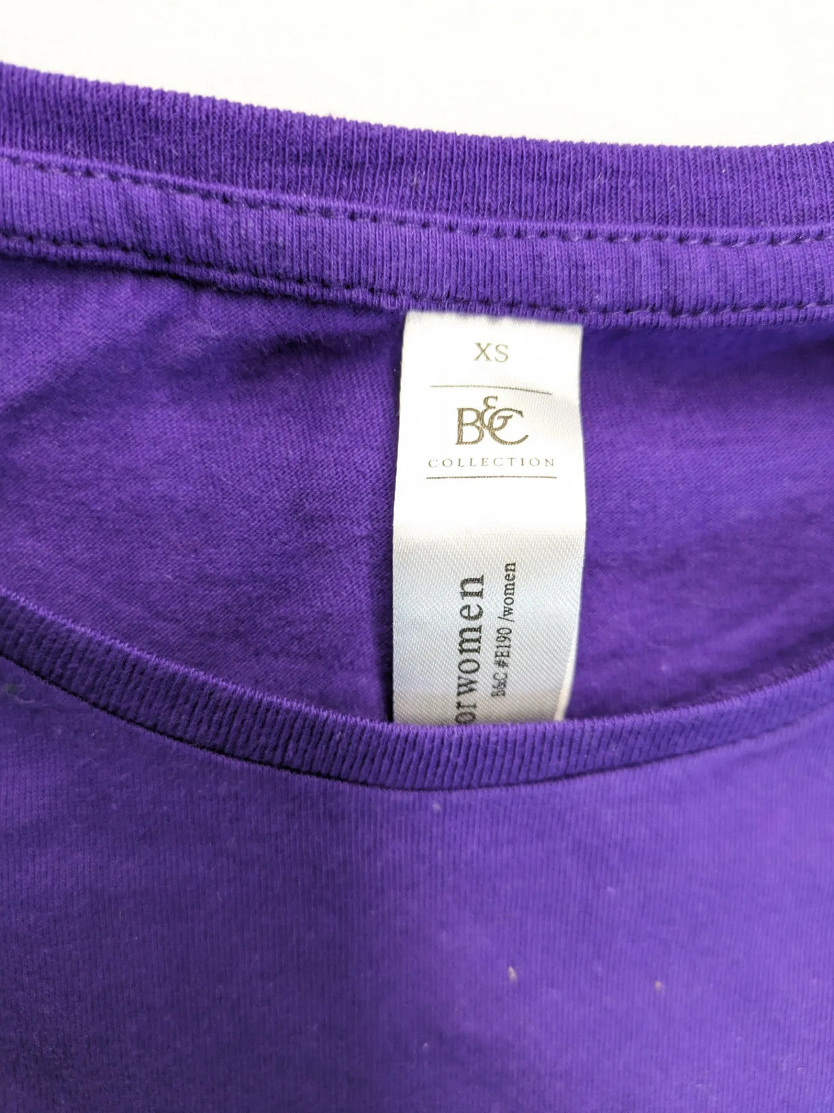 G-Unit gold and purple graphic T-shirt with raised black logo print.