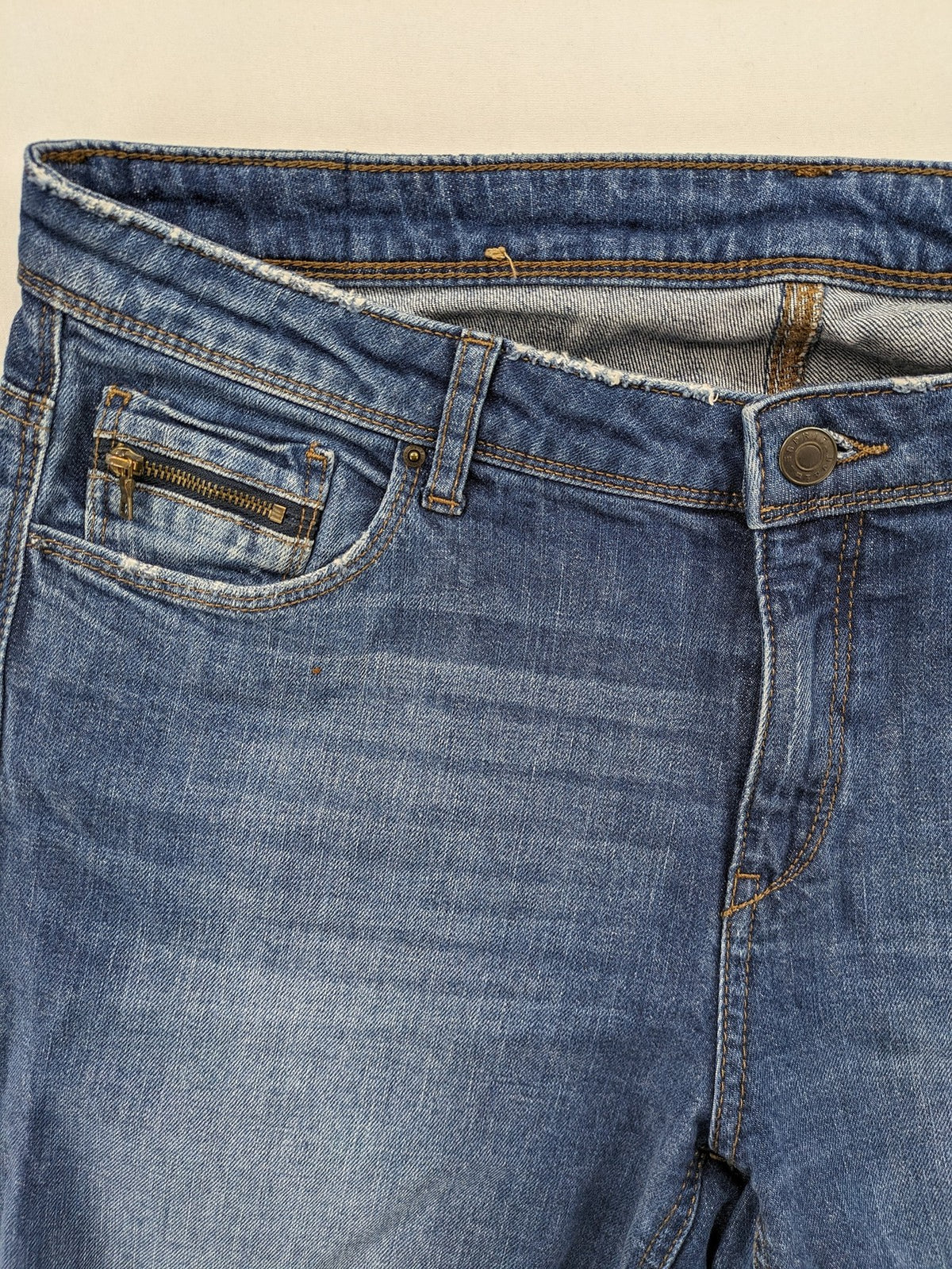 Esprit blue straight leg jeans with ripped knee details and rolled hem.