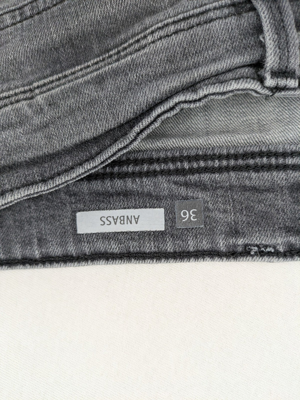 Replay grey straight jeans faded wash five-pocket style with logo on pocket.