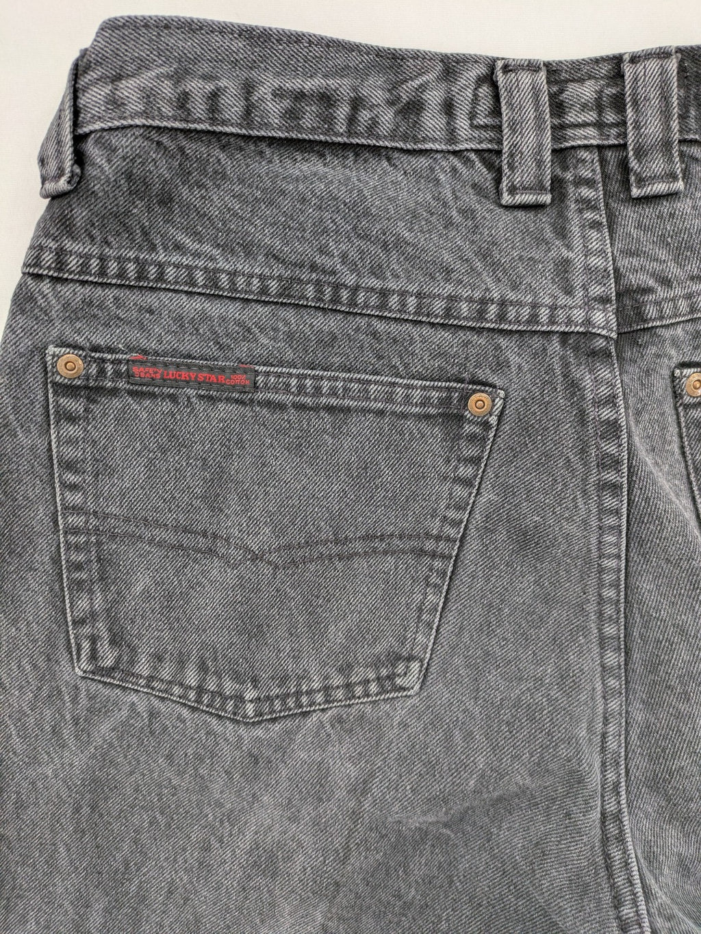 Lucky Star grey tapered high waist jeans with faded wash and red logo details.