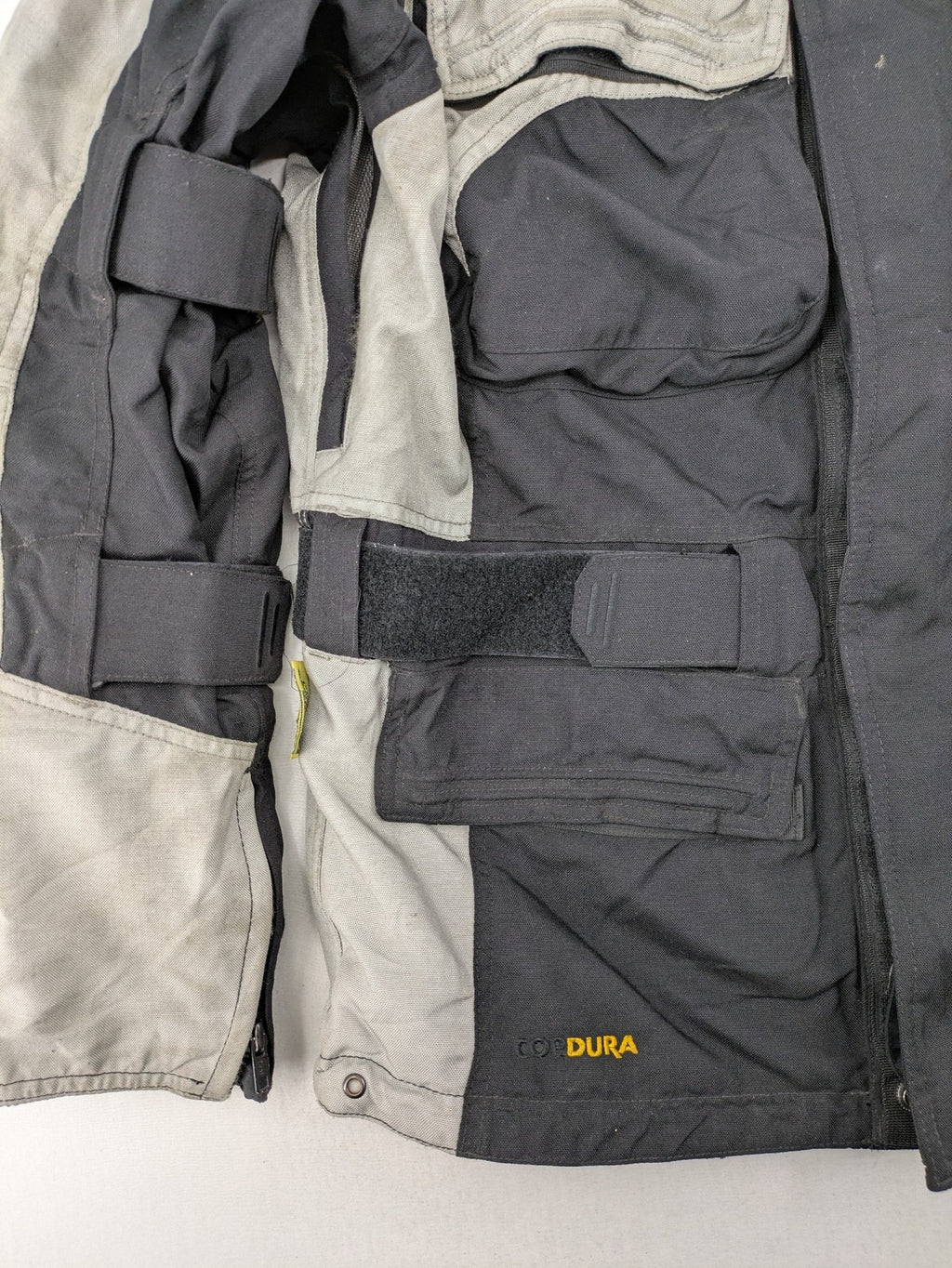 Polo motorcycle jacket cream durable Cordura fabric multiple pockets adjustable straps