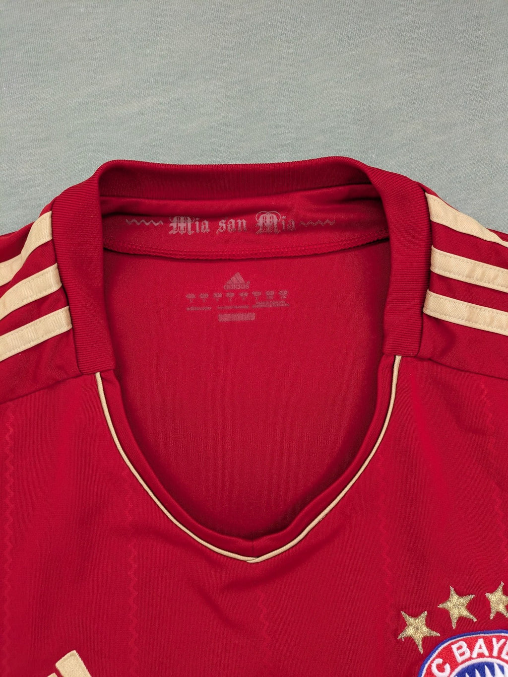 Adidas red soccer uniform with embroidered FC Bayern München crest and T-Mobile logo.