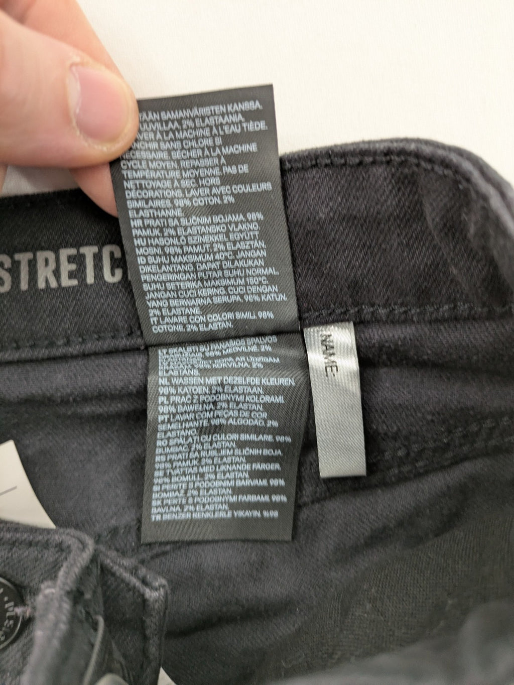 H&M grey skinny fit stretch jeans with modern design and durable denim material.