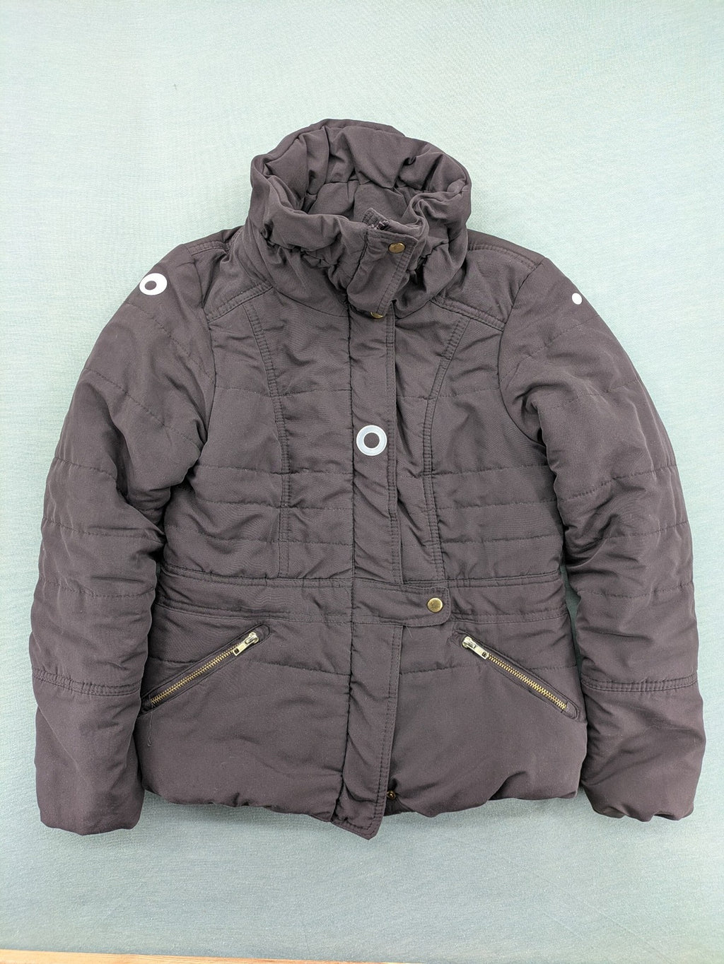 Vero Moda grey quilted jacket with high funnel neck and zippered pockets.