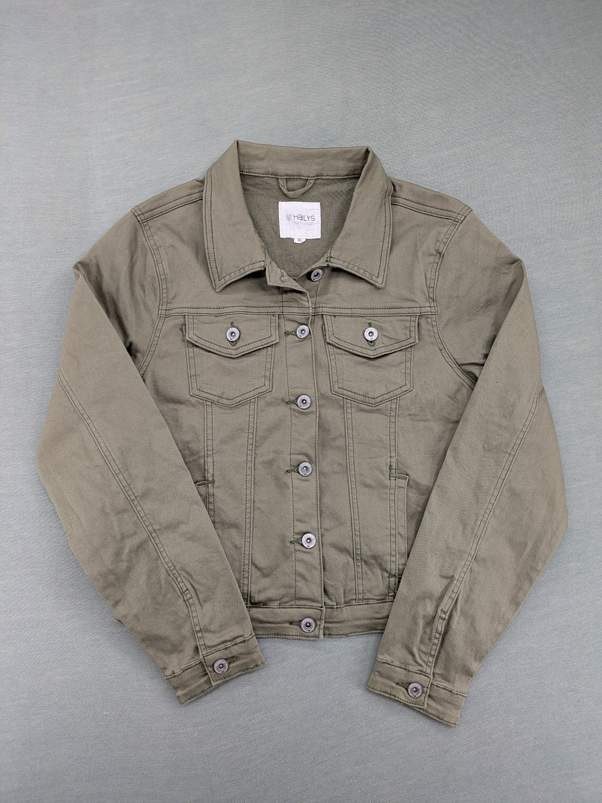 Hailys khaki denim jacket with button closure, two chest pockets, and side pockets.