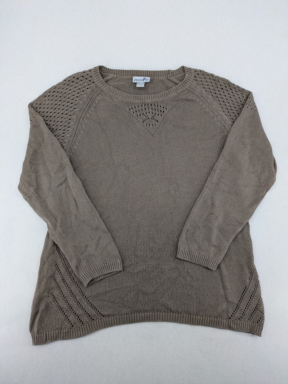 Dressin brown knit jumper with decorative open-knit details and comfortable fit.