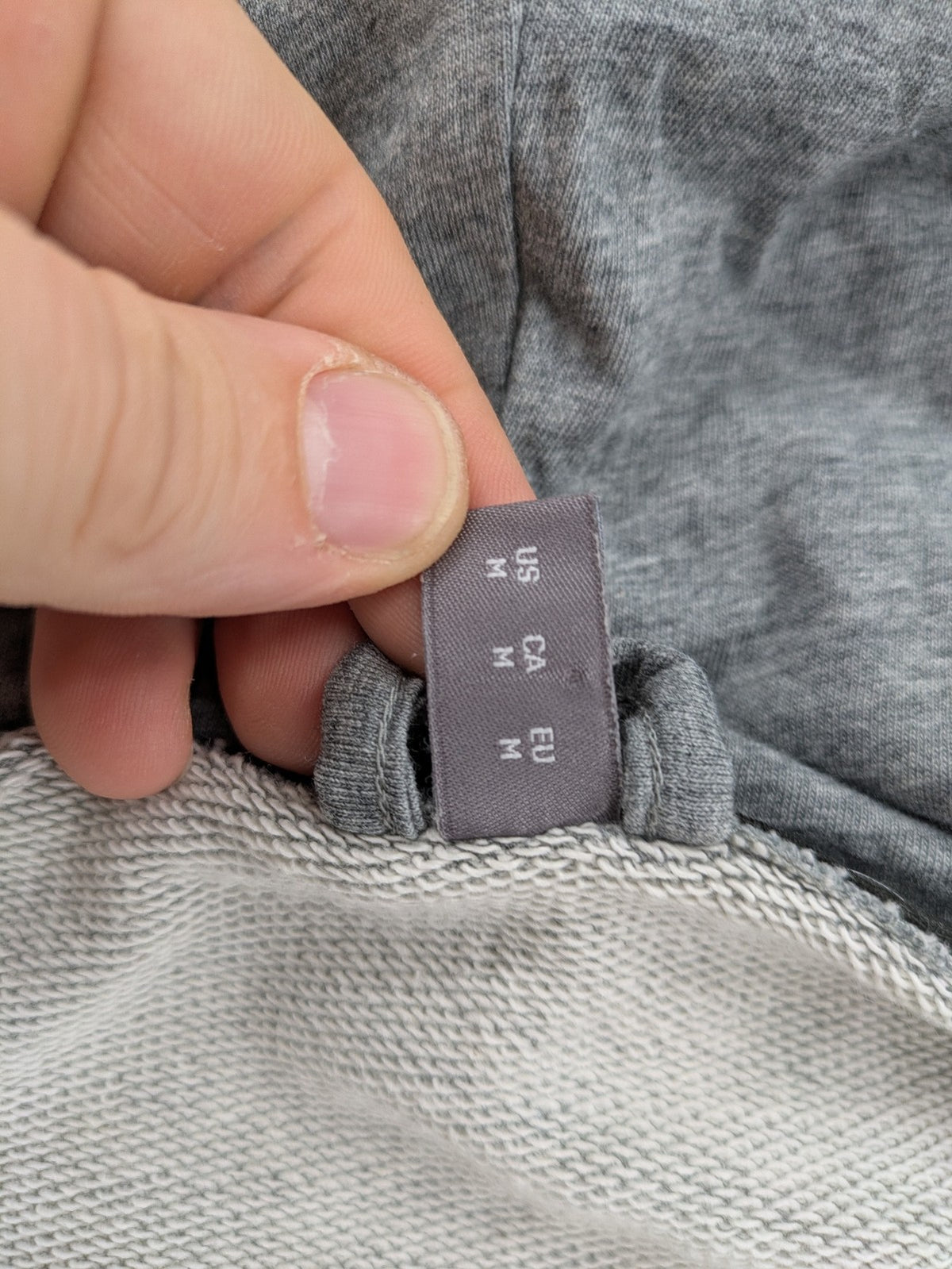 Puma grey full zip hoodie with adjustable drawstring hood and logo detail.