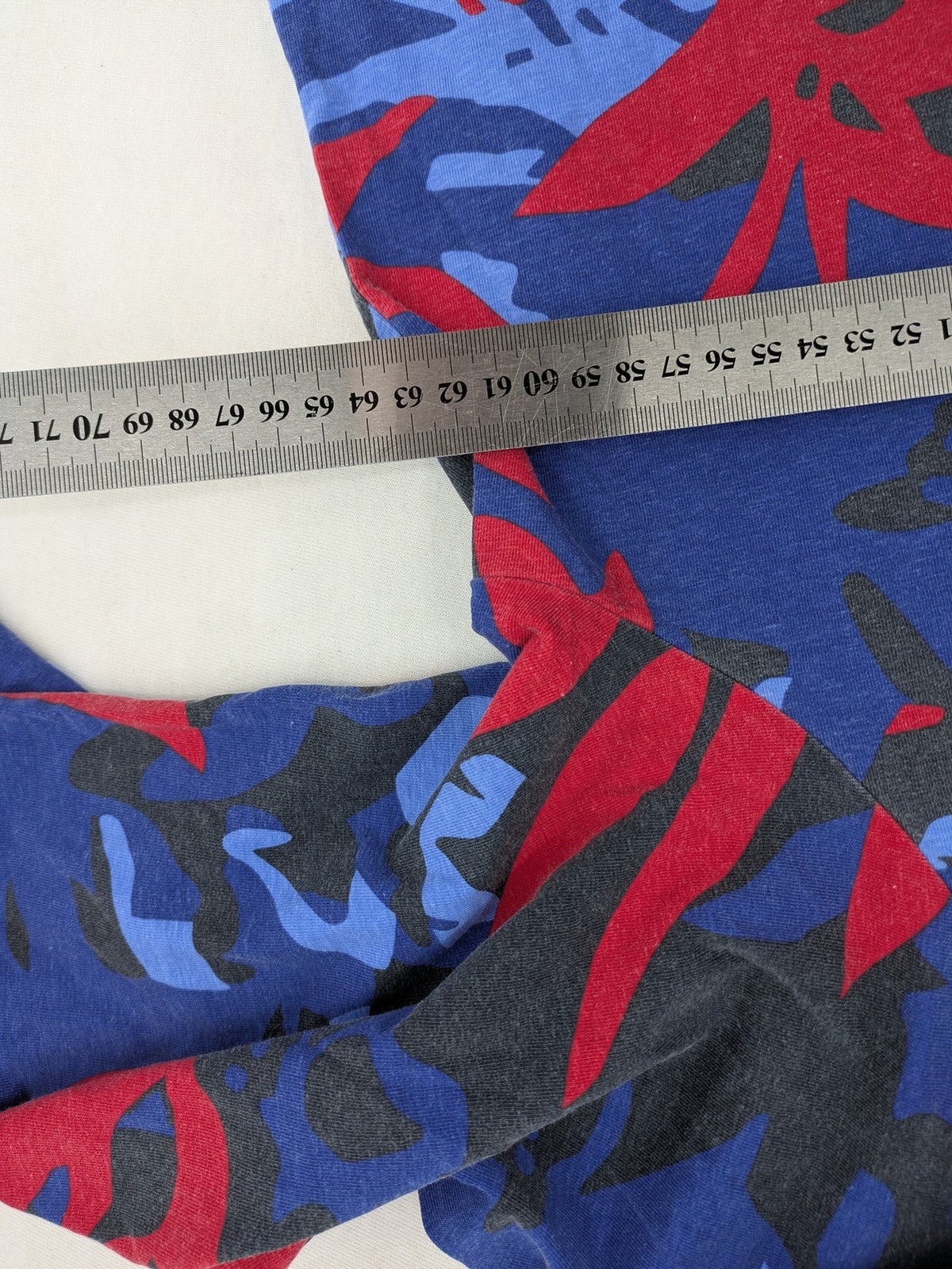 Ulla Popken blue top with floral print, V-neck, 3/4 sleeves, soft cotton blend.