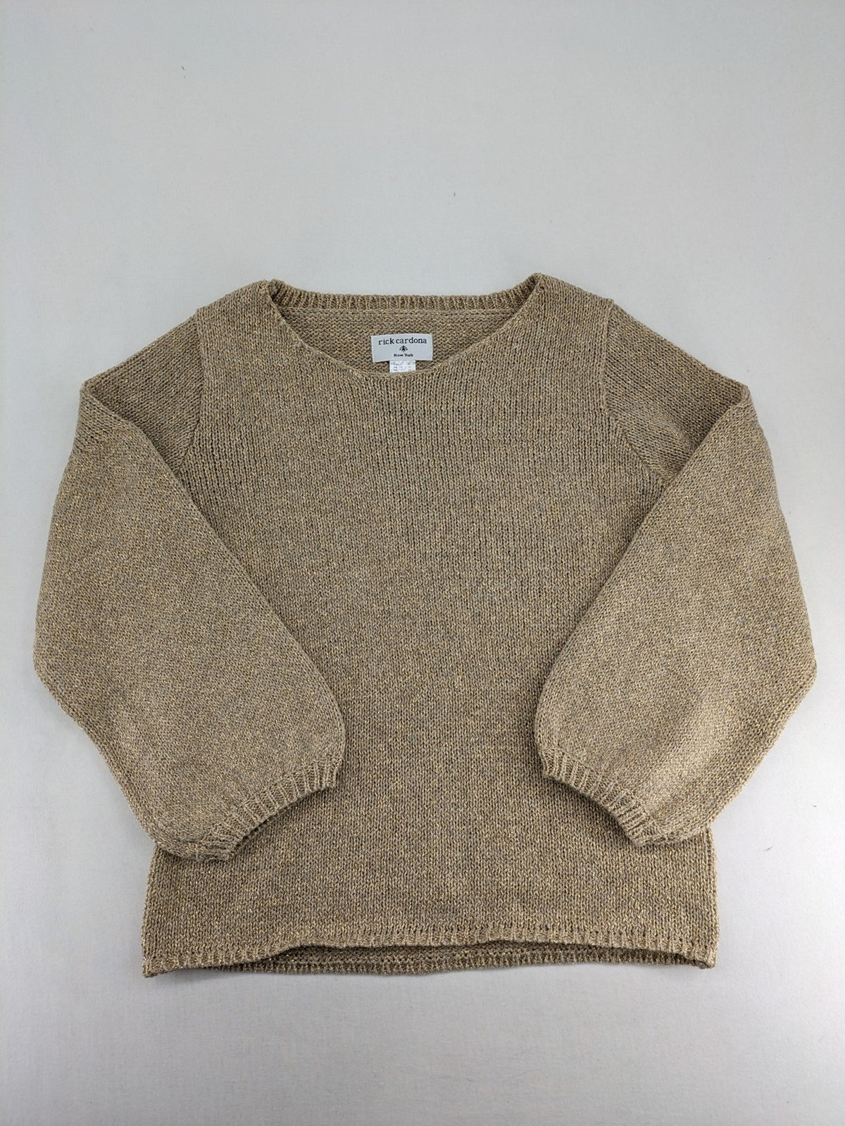 Rick Cardona beige turtle neck jumper with gold metallic thread and balloon sleeves.