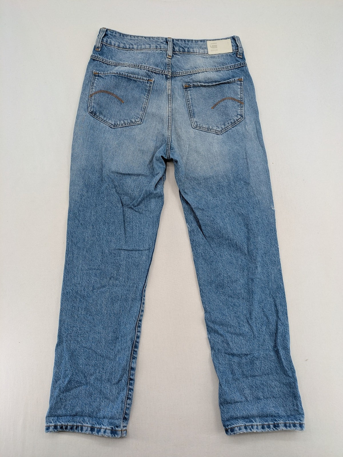 G-Star Raw blue distressed high boyfriend jeans with ripped details and classic button closure.