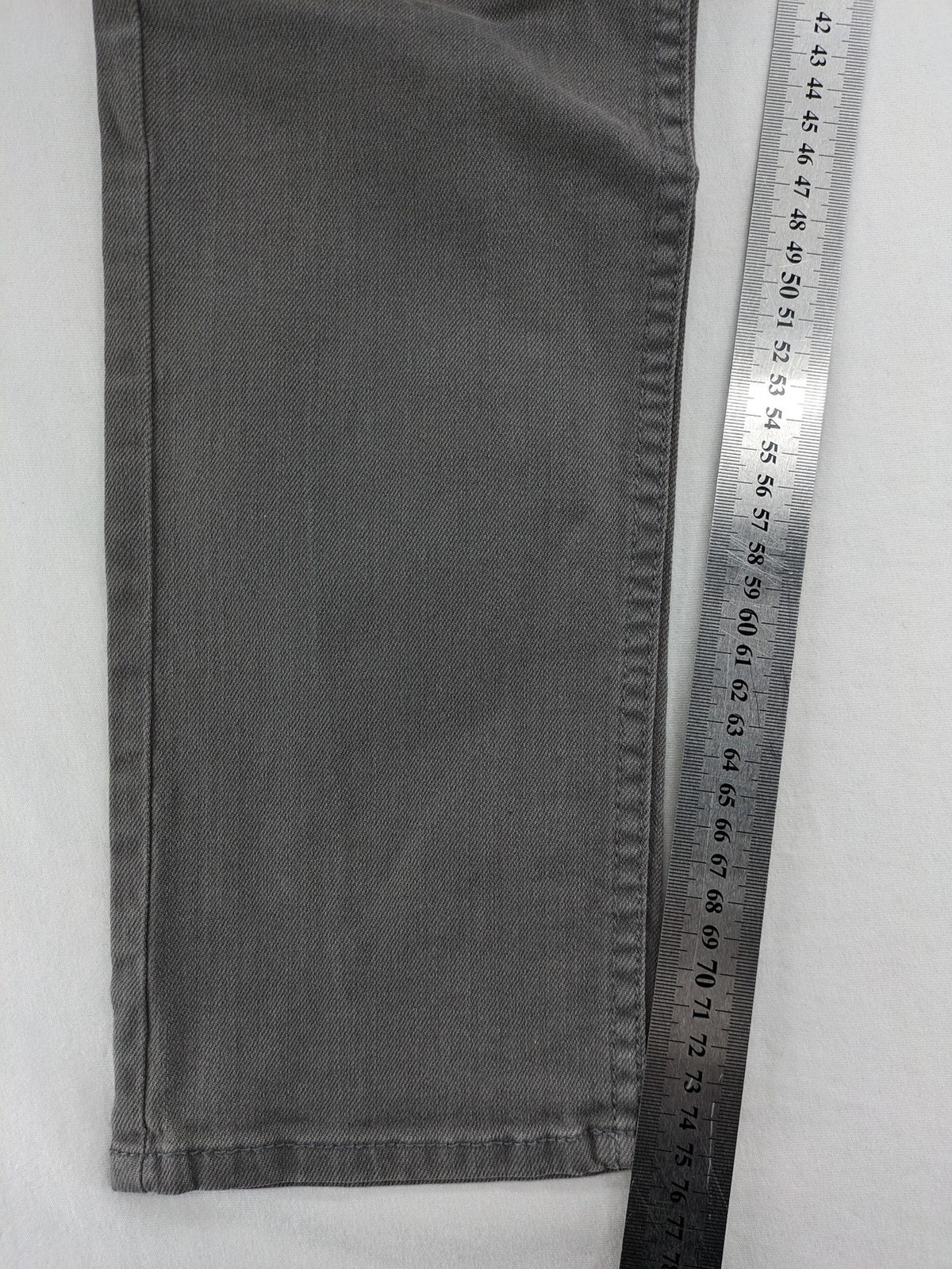 H&M grey skinny fit jeans with button closure and five-pocket design, cotton-elastane blend.