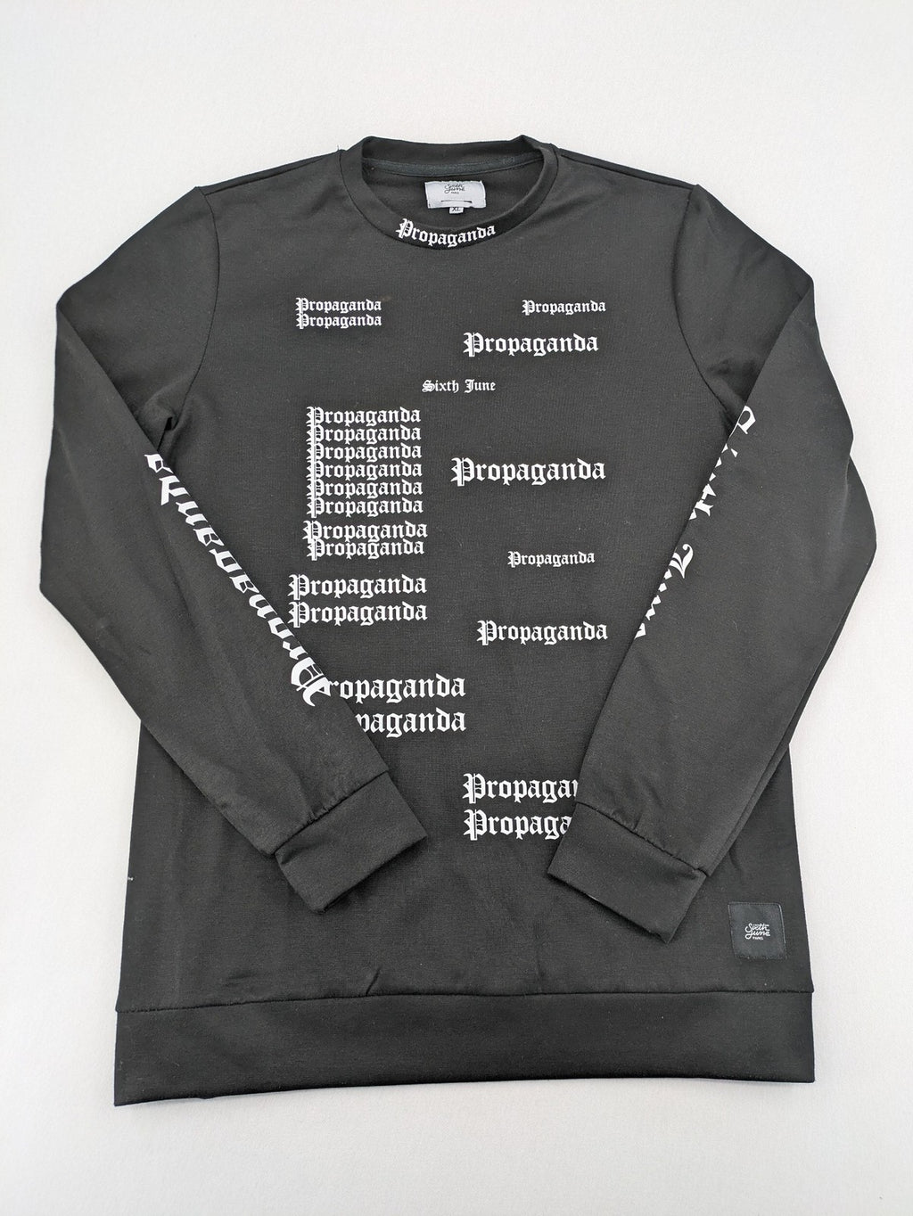 Sixth June black sweatshirt with Gothic "Propaganda" graphic print and logo details.