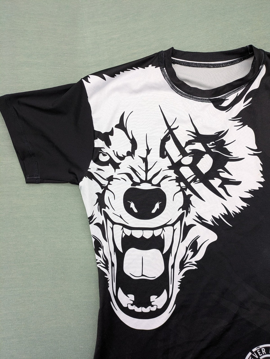 FORMMMA black rashguard featuring striking white wolf graphic and "Chechen Warrior" text.