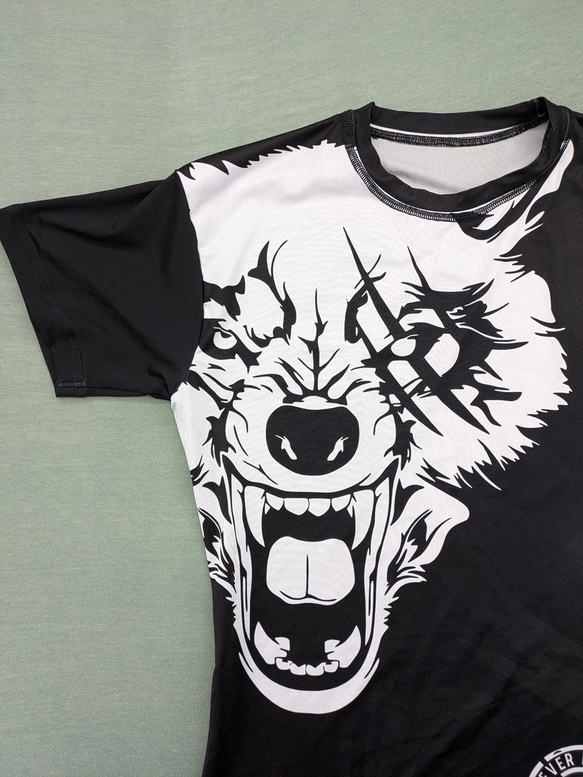 FORMMMA black rashguard featuring striking white wolf graphic and "Chechen Warrior" text.