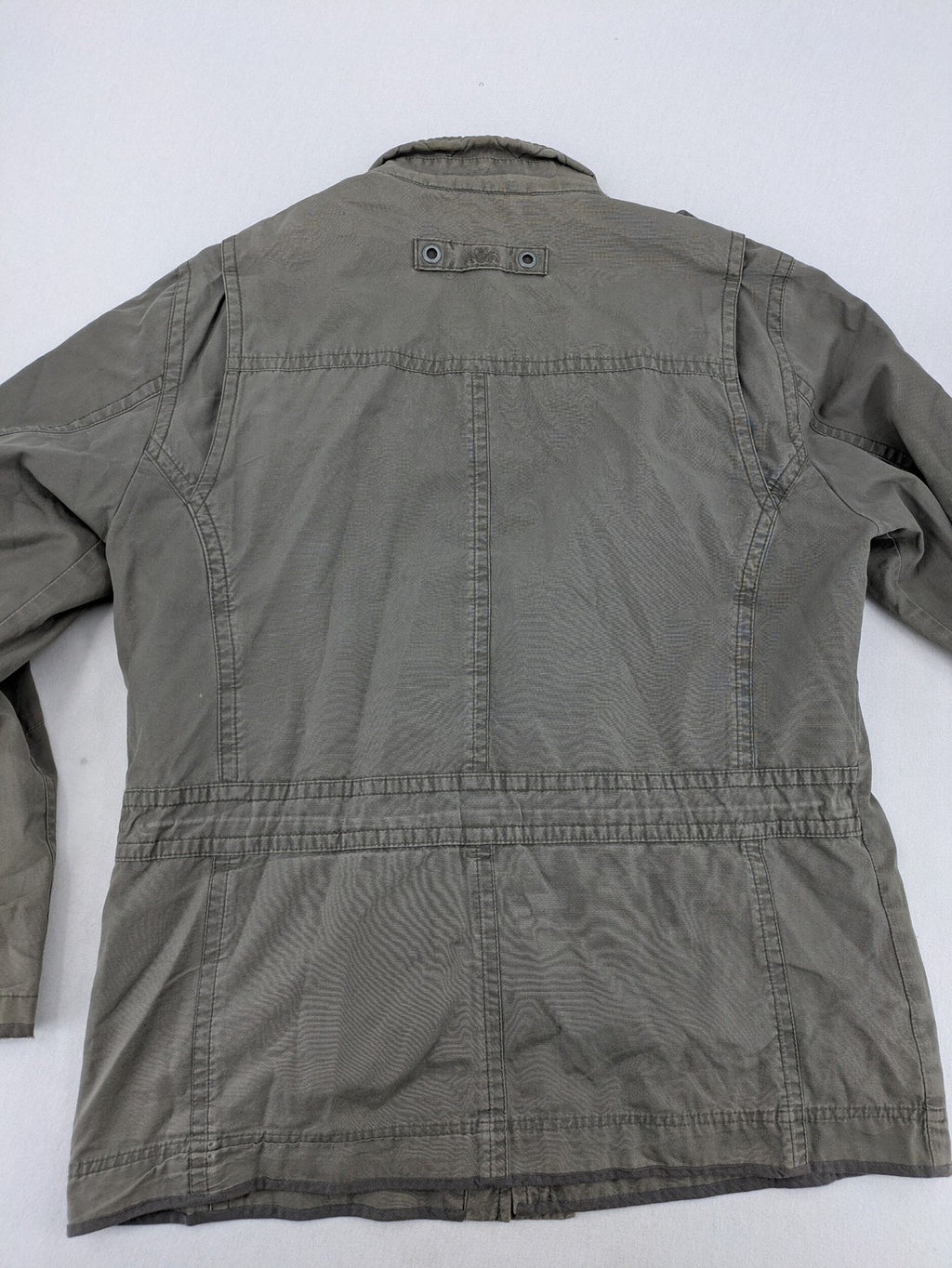 Walbusch khaki military jacket with checkered blue-white lining and multiple pockets.