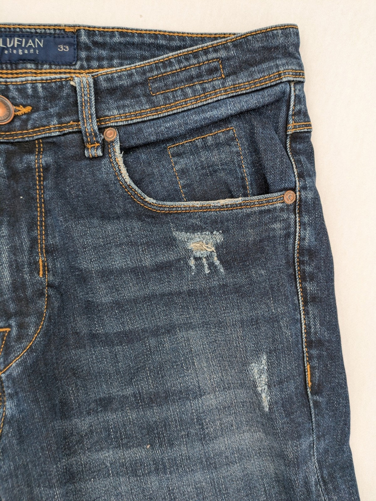 Lufian blue straight jeans dark wash distressed 5-pocket style with stretch denim.