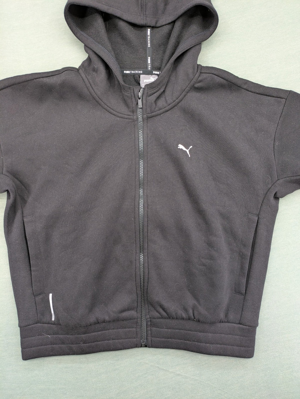 Puma grey zip-through hoodie with iconic logo and two practical pockets.