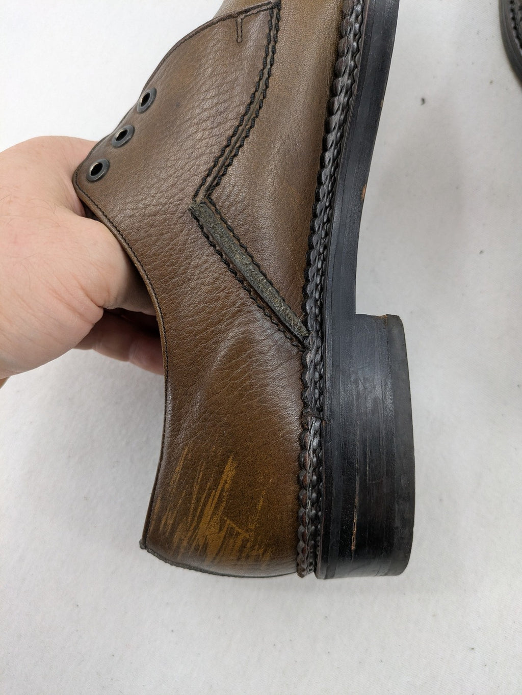 Fonda brown deck shoes genuine leather square toe design with decorative stitching.