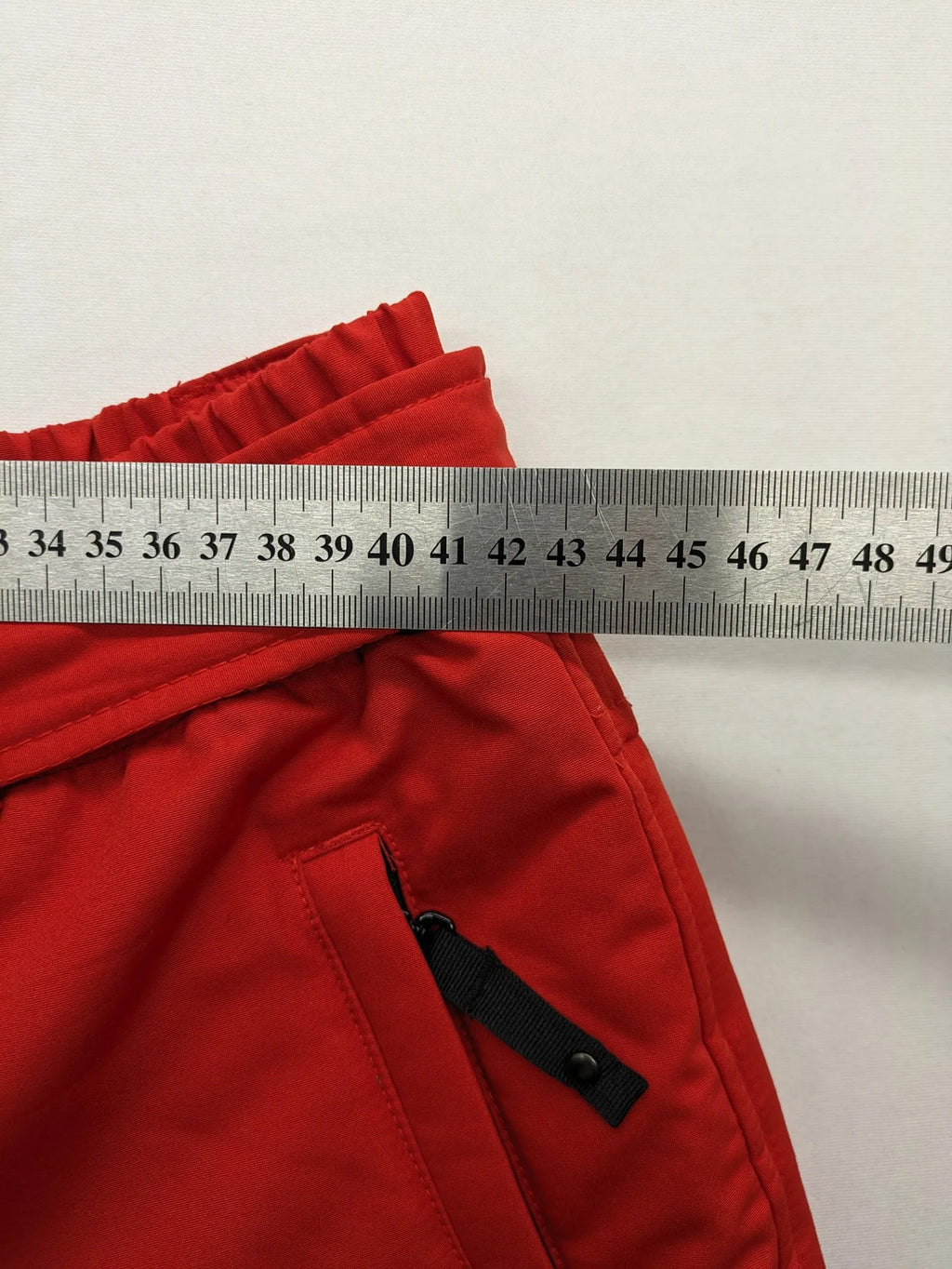 Rodeo red ski pants padded design adjustable belt multiple zip pockets