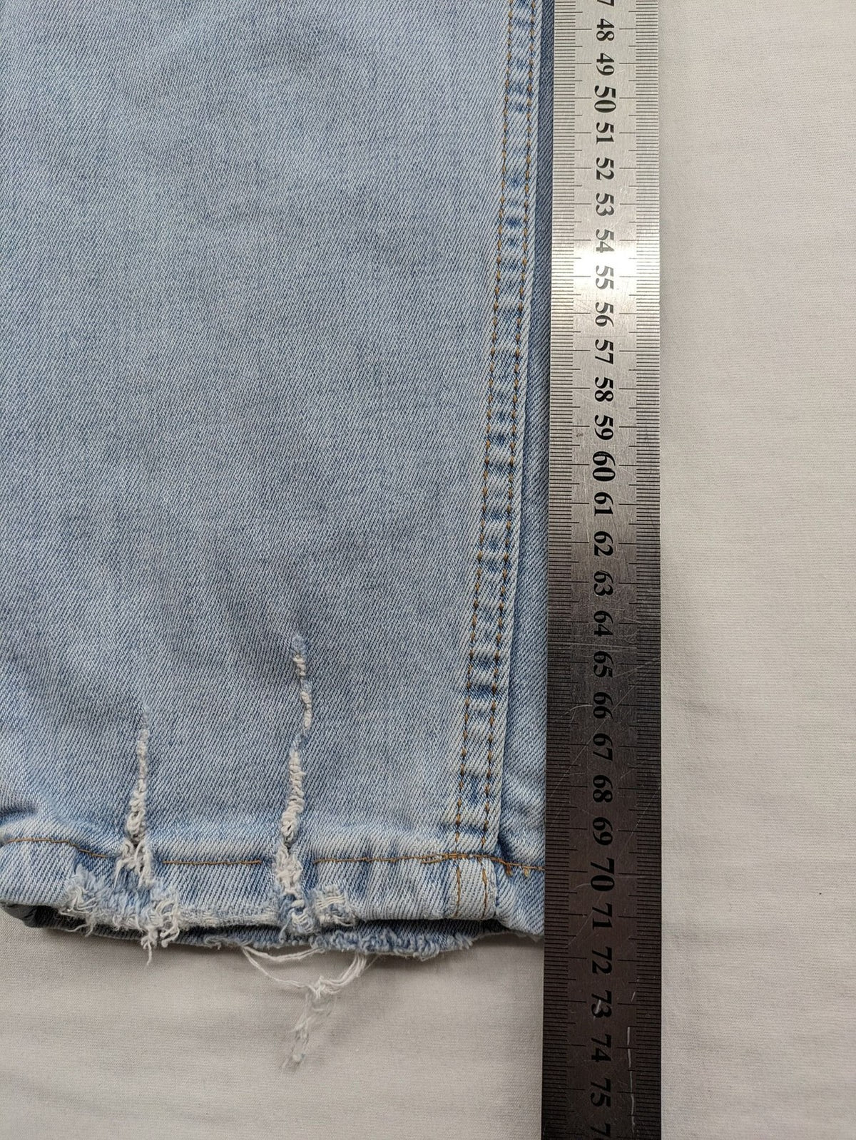 i8 Denim blue straight jeans destroyed look with frayed hems and classic button fly.