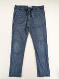 Spaghetti Mafia cream pants with elastic waistband, drawstring, and subtle front pleats.