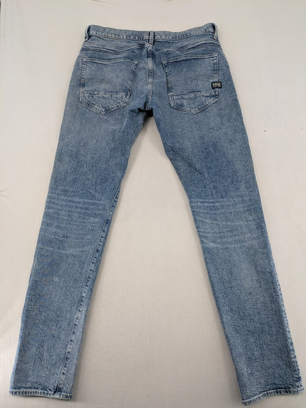 G-Star Raw blue slim fit jeans with 5-pocket design and light wash denim.
