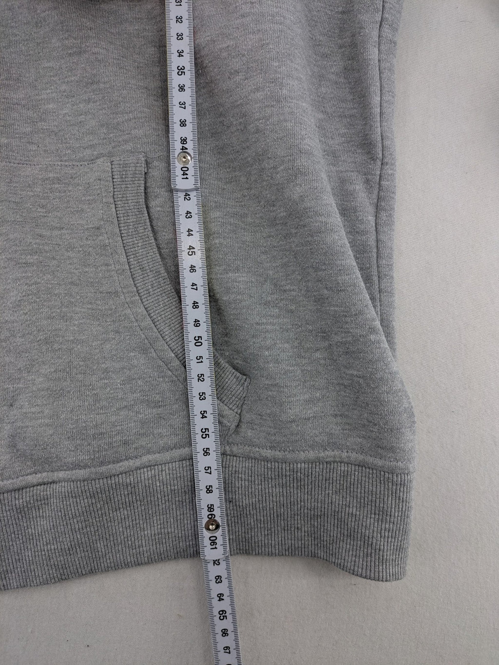 Primark grey zip-through hoodie featuring yellow Smiley logo and Nevermind graphic.