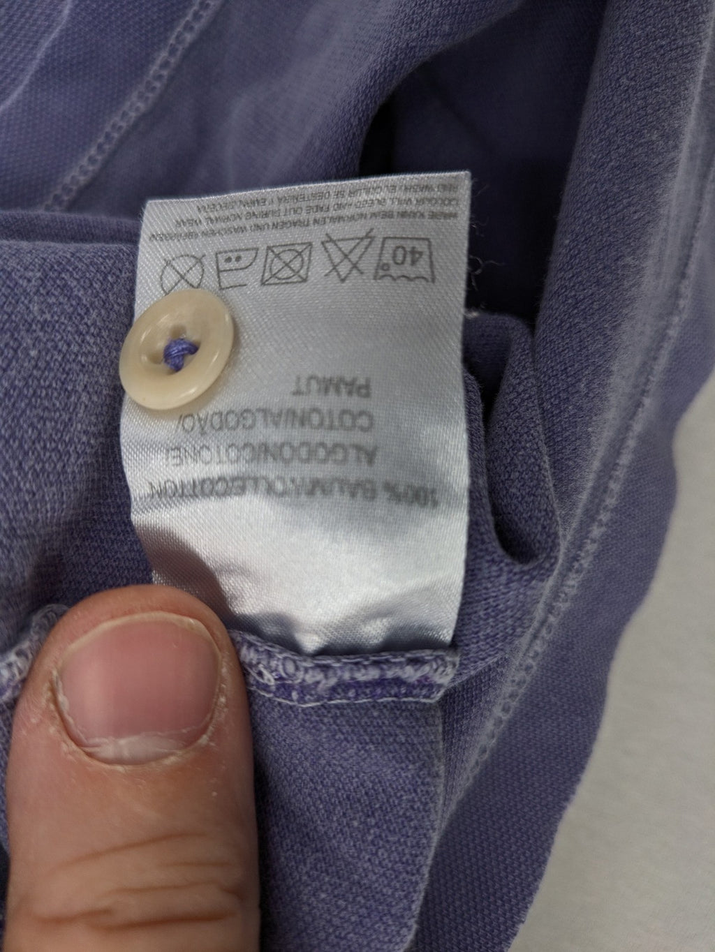 Marc O'Polo purple polo shirt garment dyed cotton with embroidered logo and intricate details.