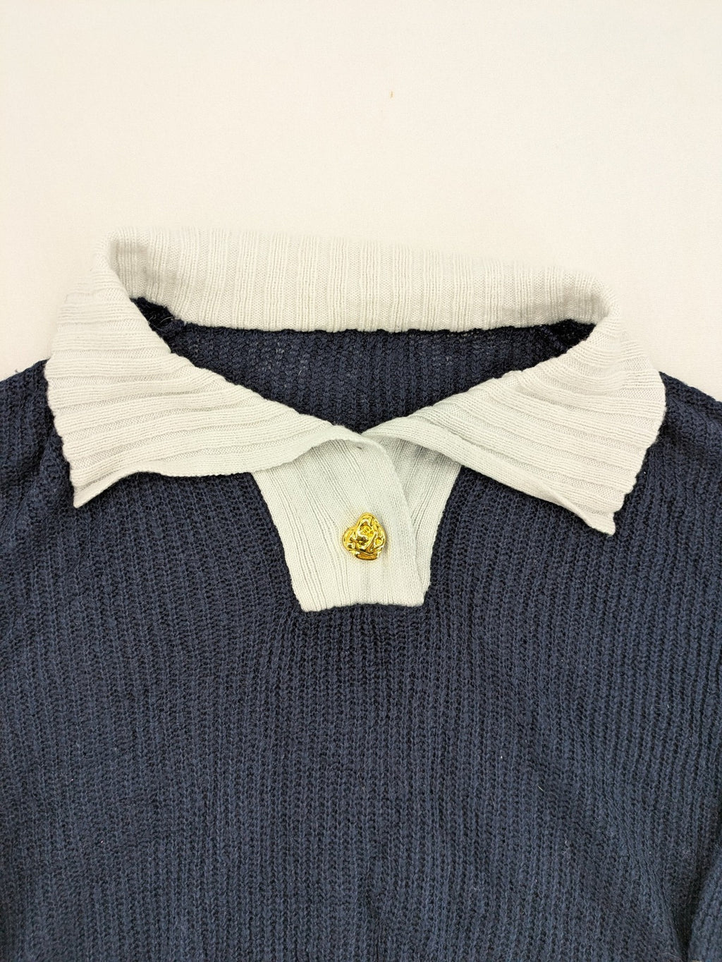 Dazy navy turtle neck jumper with contrasting collar and gold heart button detail.