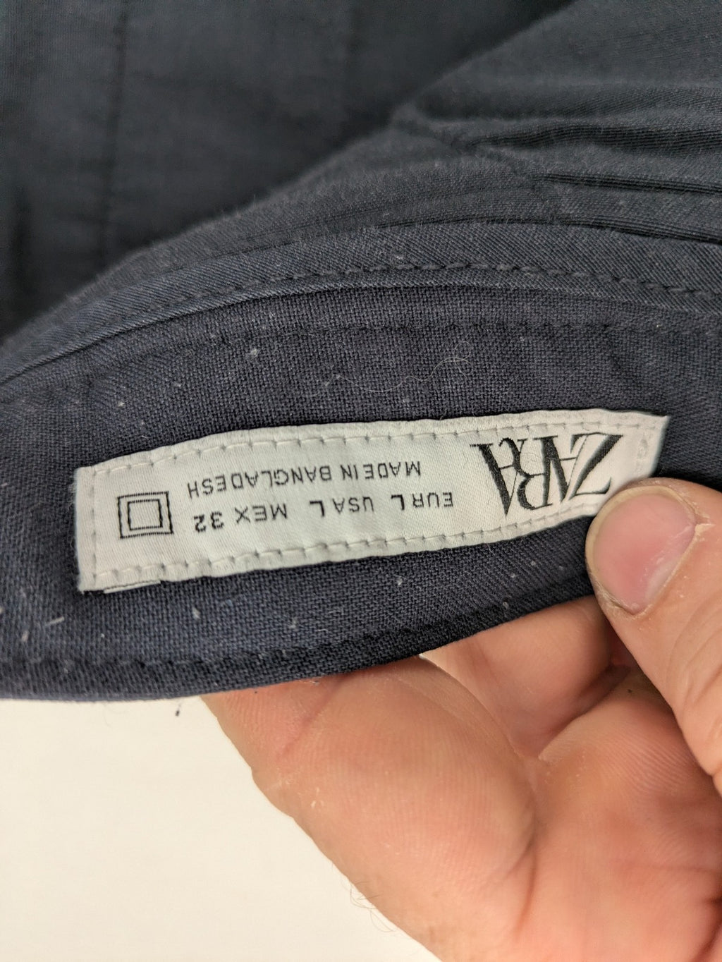 Zara navy chinos flat front design with stretch fabric for comfort and versatility.
