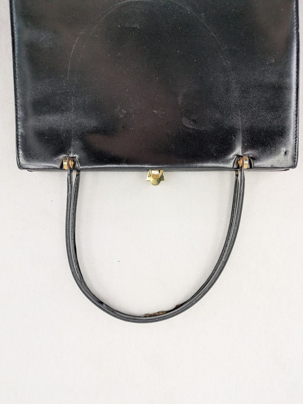 Eleganz black messenger bag vintage 50s 60s style with structured shape and gold accents.