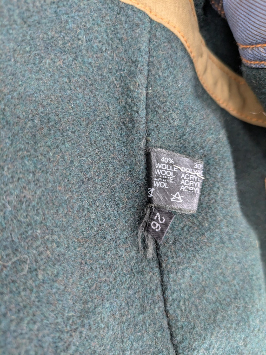 Studio Novum khaki trench coat double-breasted design with belt and wool lining.