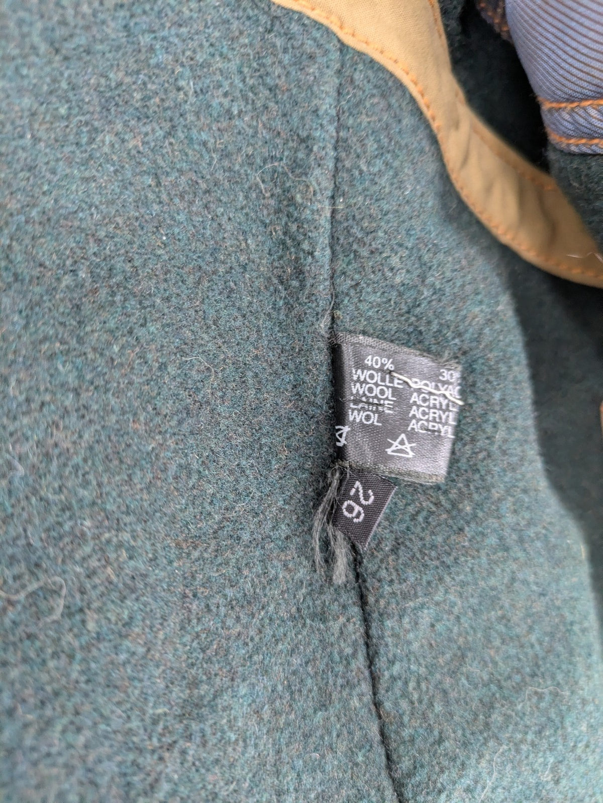 Studio Novum khaki trench coat double-breasted design with belt and wool lining.