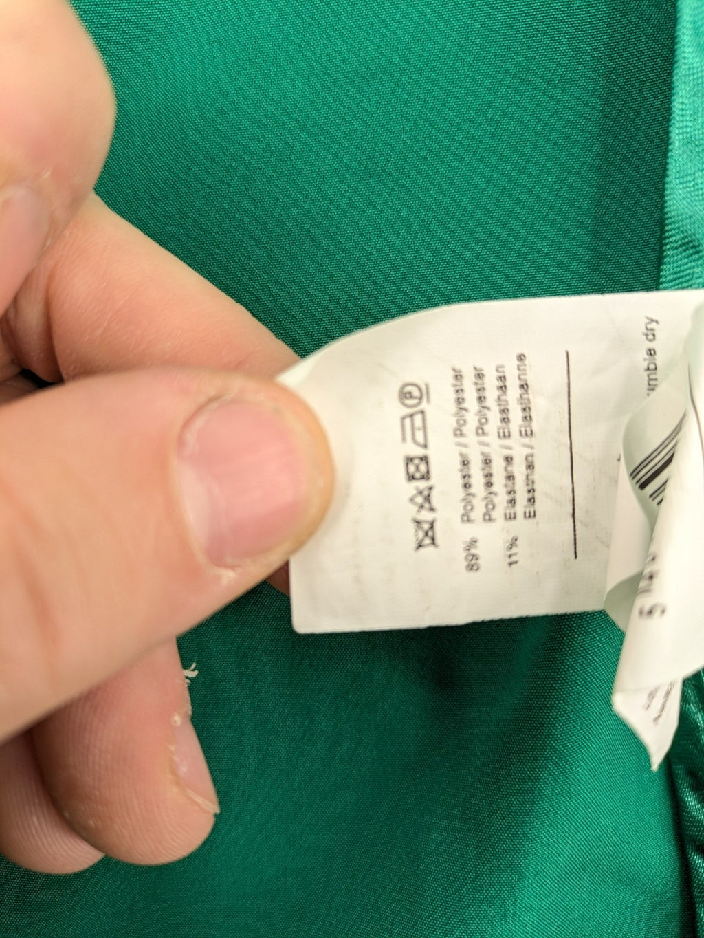 Promiss green blazer jacket single-button design with notch lapels and decorative pockets.