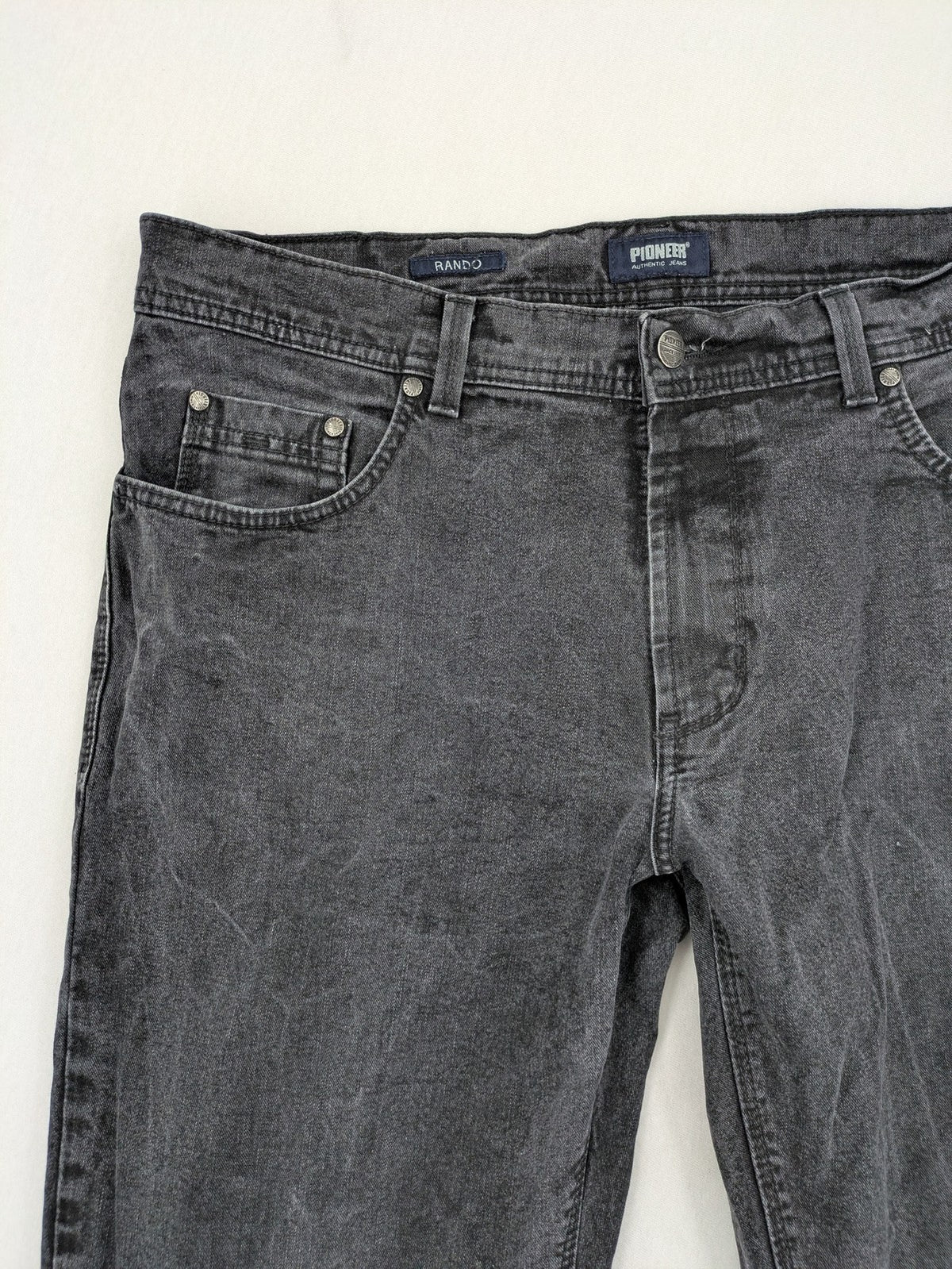 Pioneer grey straight jeans with washed finish and stretch material, classic design.