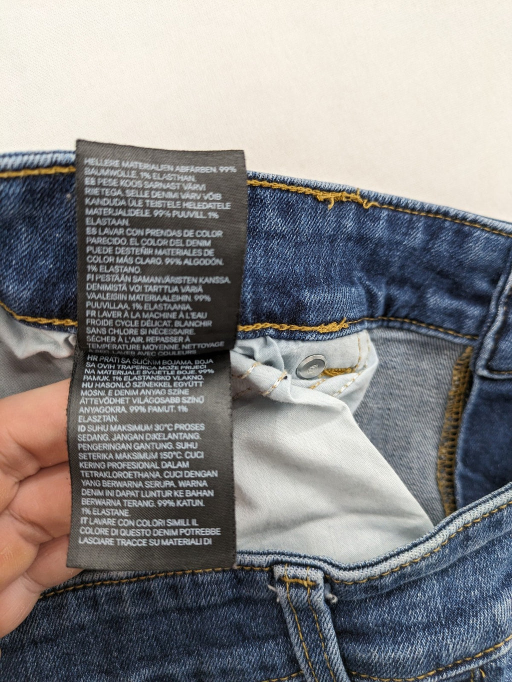 H&M blue skinny jeans with stretch denim and slim fit design.