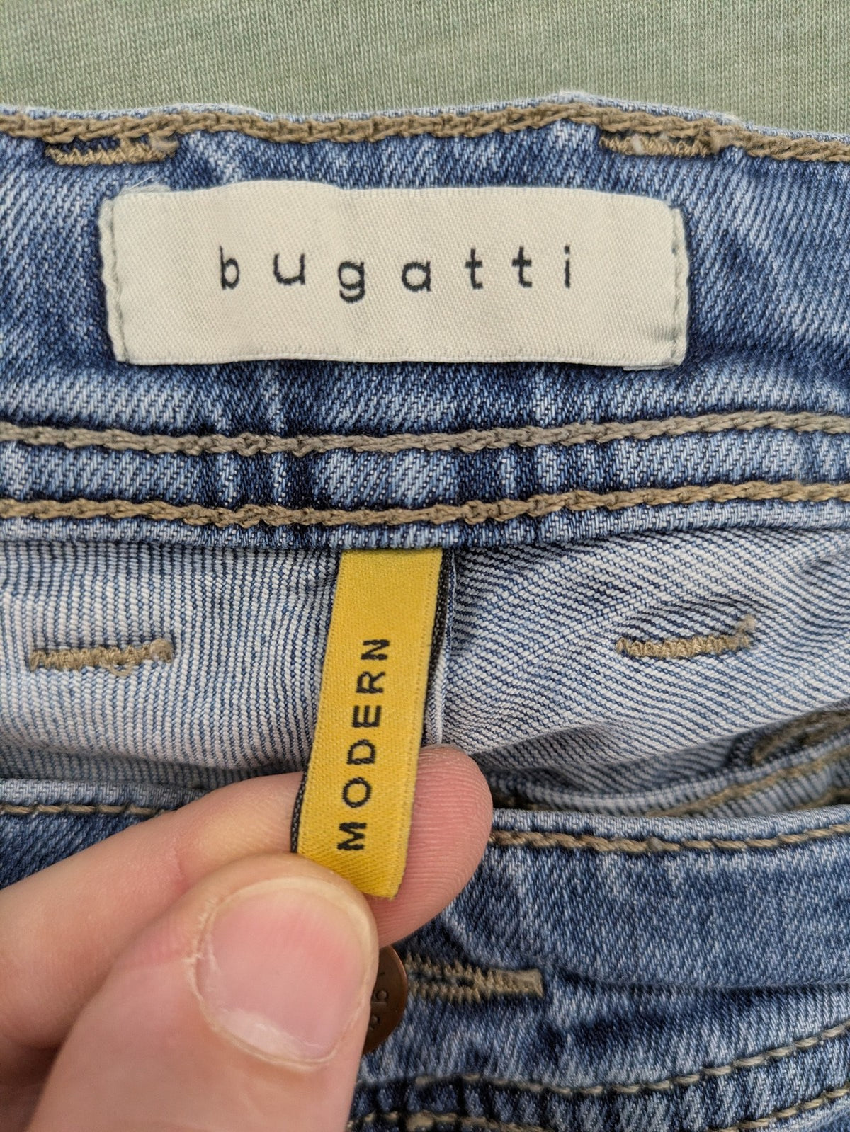 Bugatti blue straight jeans with classic 5-pocket design and light wash denim.