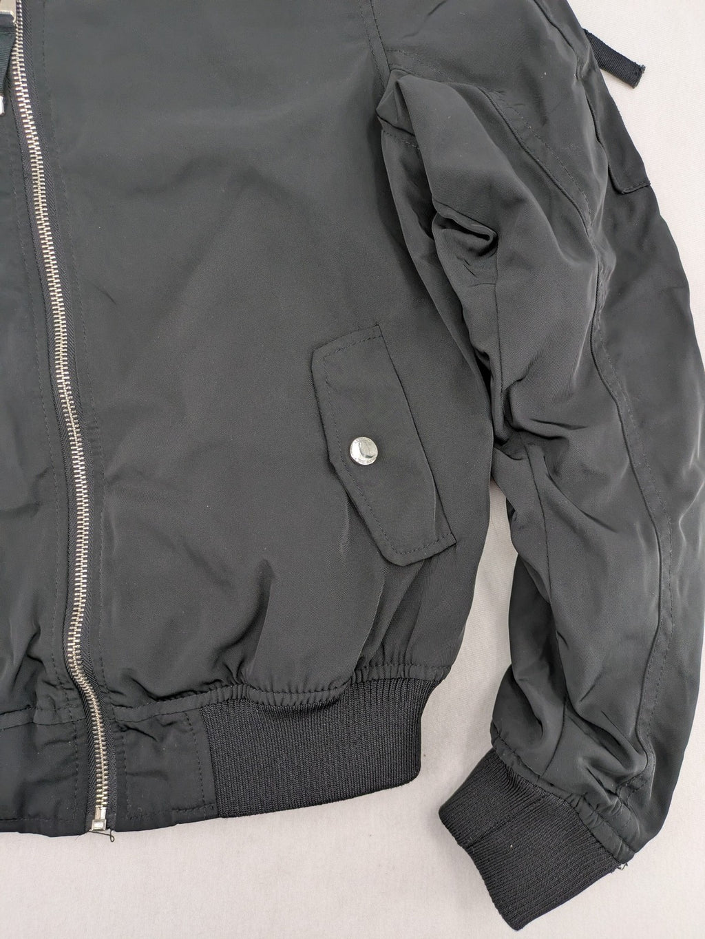 FB Sister grey bomber jacket with full zip, ribbed cuffs, and smooth polyester material.