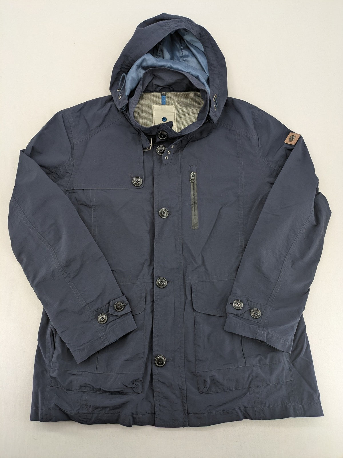 Reset navy parka jacket windproof with adjustable hood and zippered chest pocket.