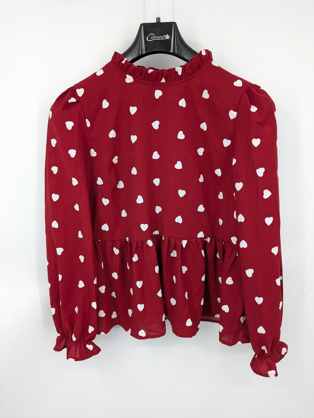 SHEIN burgundy top with white heart pattern and ruffled neckline detail.
