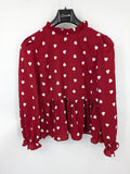 SHEIN burgundy top with white heart pattern and ruffled neckline detail.