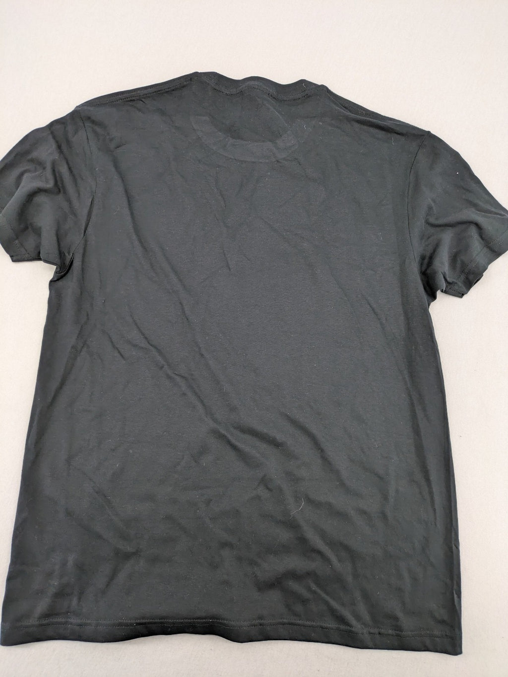 Smiley grey band t-shirt featuring yellow Nirvana smiley face logo on chest.